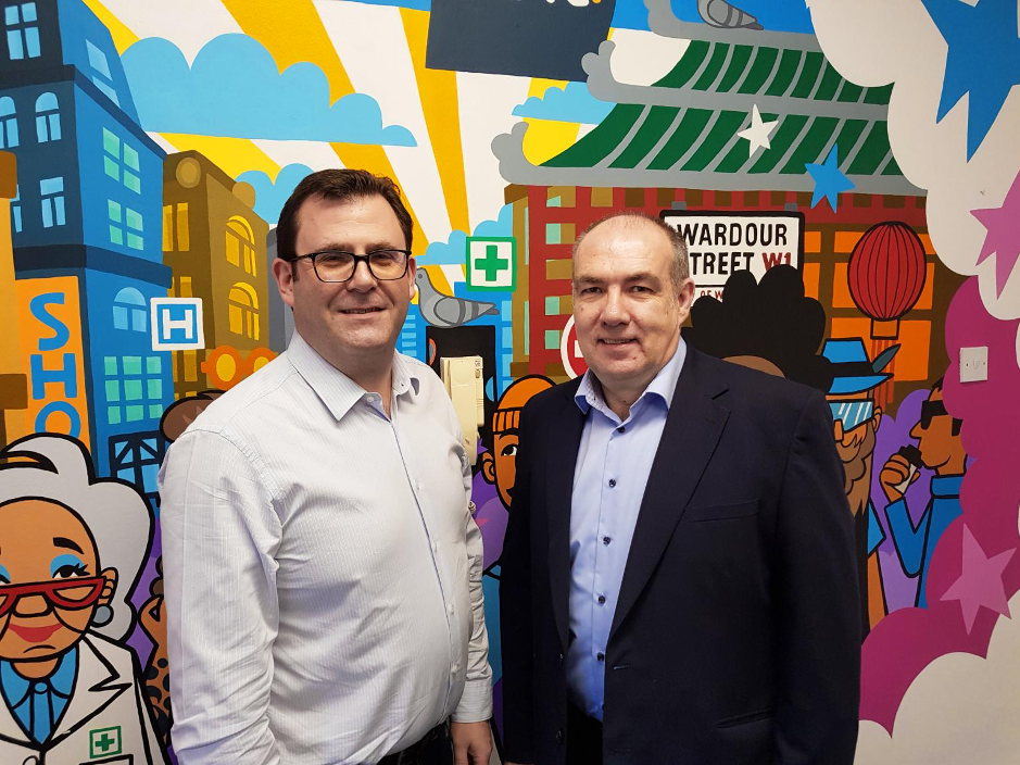 Director and community pharmacist share a photo together after the talk on the new community pharmacist consultation service which was put into place October 2019